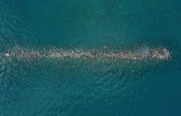 Aerial view of  the water breaker on the coastline of  the Mediterranean Sea.