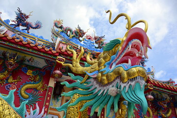 Fototapeta premium Chinese art shrine in Thailand. It is the worship of people in Chonburi, Thailand. Chinese sculpture Made of stone decorated inside the shrine area. Chinese dragon statue Chinese decoration According
