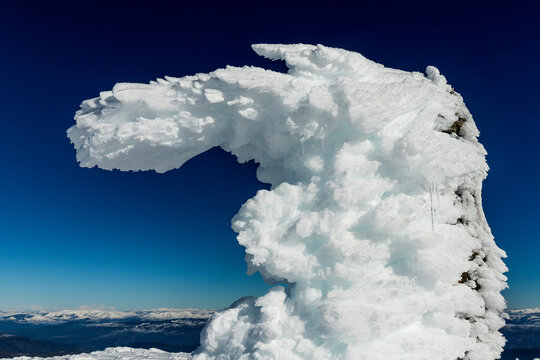 summit landmark covered entirely in icy snow that forms a spectacular shape. Cabeza de Manzaneda Peak