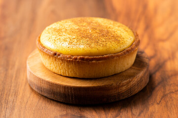 Delicious fresh baked custard tart sprinkled with ground nutmeg