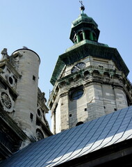 clock tower. medieval architecture. ancient clock on the tower of the old Catholic church. church with a tower with a green copper-plated dome and an antique clock