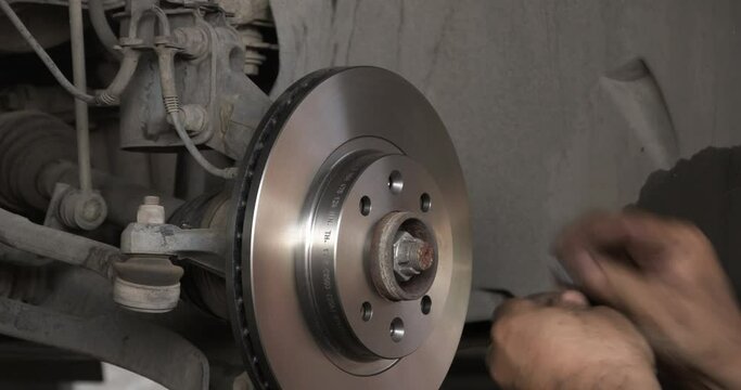Car Brake Disk Replacement In Car Repair Shop.