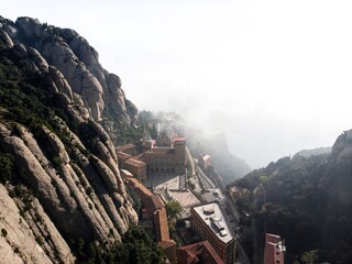 Panorama view of Santa Maria de Montserrat Abbey mountain monastery in Monistrol near Barcelona...