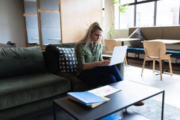 Caucasian businesswoman working in creative office