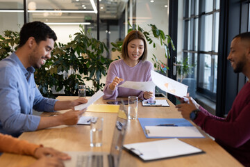 Diverse group of business people working in creative office