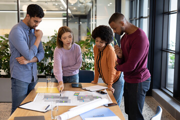 Diverse group of business people working in creative office