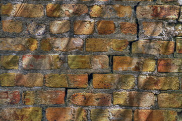 old red brick wall with large crack