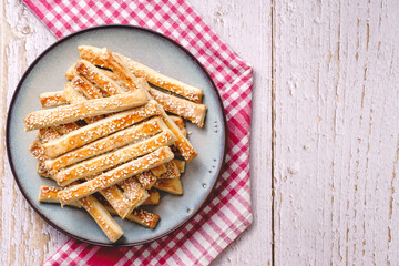 salty sesame bread sticks traditional homemade baked snacks on the table - top view close up healthy vegan or vegetarian food concept with copy space