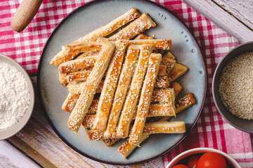 salty sesame bread sticks traditional homemade baked snacks on the table - top view close up healthy vegan or vegetarian food concept