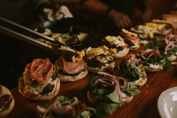 preparation of hamburgers for catering a social event.