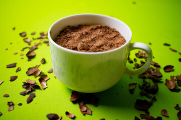 cocoa inside a white cup with green background
