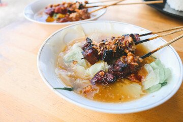 Mie Ongklok, traditional noodles from Wonosobo Indonesia with Satay