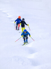 Fototapeta na wymiar People are enjoying mogul skiing and snow boarding 