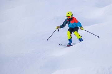 People are enjoying mogul skiing and snow boarding	