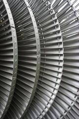 Overlapping circular turbine fan blades abstract vertical industrial background pattern