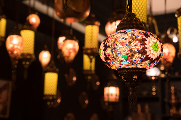 Colorful lamp on celebration festival.Arabic lamp lighting with colors on muslim lantern shining in the cafe and restaurant.