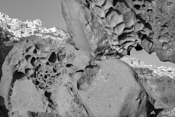 Santorini - The look to Oia across the pumice boulders.