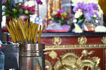 Longshan Temple, Taipei, Taiwan - January 15, 2021: the worshippers throw the divination blocks to ask the fortune stick for advice from God.