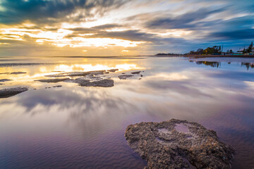 Rocks at low tide in the sunrise