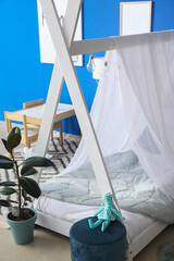 Interior of modern children's room with stylish bed