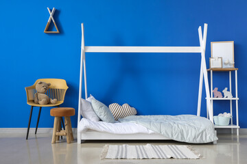 Interior of modern children's room with stylish bed