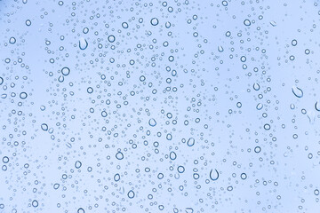 Fototapeta na wymiar Rain drops on window glasses texture background