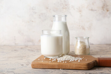 Bottles of tasty rice milk on table
