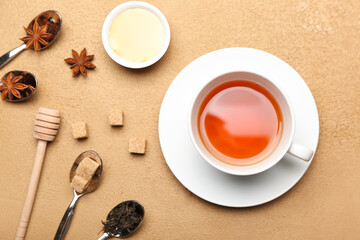 Composition with cup of hot tea on color background