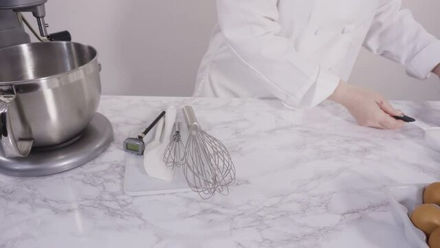 Time lapse. Mixing ingredients to bake sheet cake with Italian buttercream frosting.