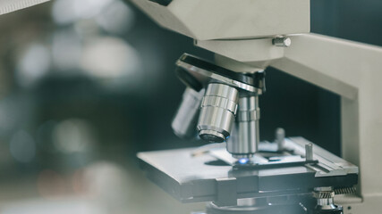 Scientific research team. microscope with three lenses
