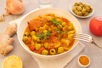 Traditional tagine plate with chicken, lemon and olive