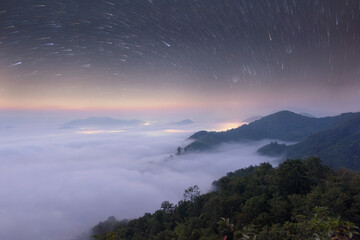 Fototapeta premium Beautiful sunshine at misty morning mountains,Foggy Landscape. Early Morning Mist
