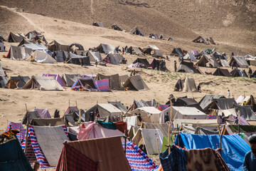 Daily refugee village life in Badghis, Afghanistan in the desert.