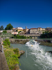 Fototapeta na wymiar Dora Baltea river passes through the city of Ivrea, Turin, Piedmont, Italy