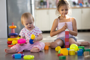 Two children play toys