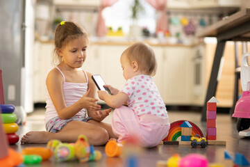 Two children play toys