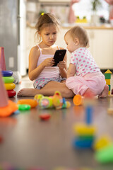 Two children play toys