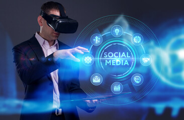 Business, Technology, Internet and network concept. Young businessman working on a virtual screen of the future and sees the inscription: Social media