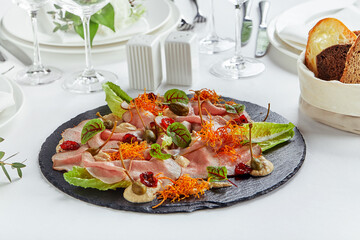 Beautifully decorated catering banquet table with different food snacks and appetizers