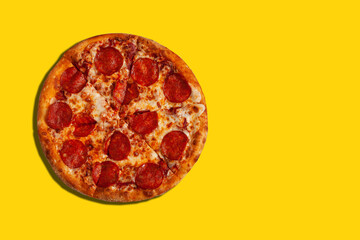 Tasty pizza. Piece of pepperoni pizza on yellow background. 