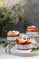 Easter cake kraffin. Craffins with raisins, candied fruits and sprinkled with powdered sugar. Close-up of homemade pie. Cruffin.