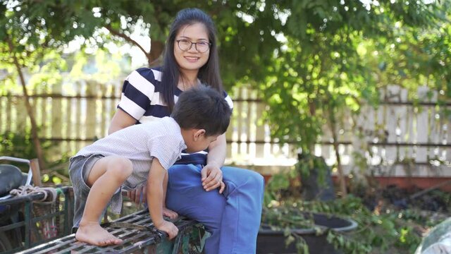 Asian boy about 3 year and 10 months crying in bad mood and behavior problem being persuade and encouraged by his mother, parenting concept - Powered by Adobe