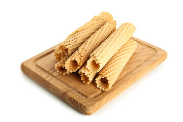 Board with wafer rolls with condensed milk isolated on white background
