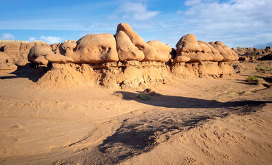 Fototapeta na wymiar Out of this world Goblin Valley State Park unique mushroom shaped sandstone hoodoos and formations in a strange semi desert setting in Green River Utah