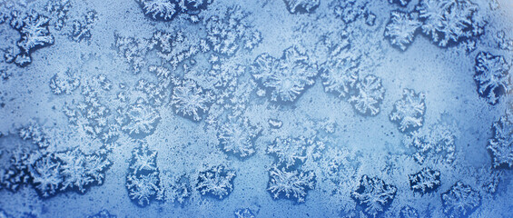 snow pattern on the glass from frost. snowflakes on the window