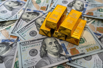 Gold bullion with us money for design close up