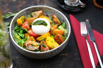 
Mozzarella with green pesto served with colorful tomatoes on spinach leaves. A colorful, healthy breakfast.
Food served on a plate, food styling, serving suggestions, culinary photography.