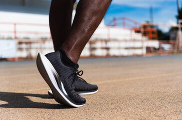 Asian young athlete sport runner black man wear feet active ready to running training at the...