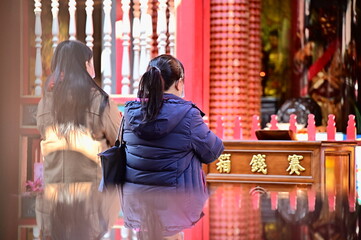 Longshan Temple, Taipei, Taiwan - January 15, 2021: the worshippers hands together to worship the Gods.