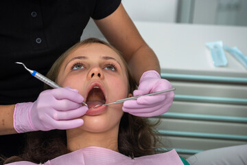 young girl at the dentist's reception